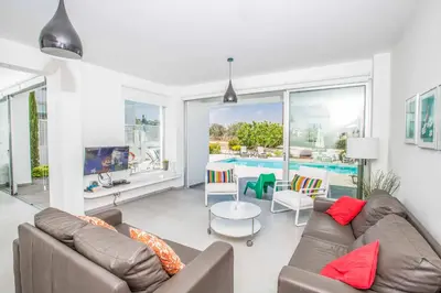 a living room with a couch and a table at Protaras Greco Villa CCV2 in Protaras
