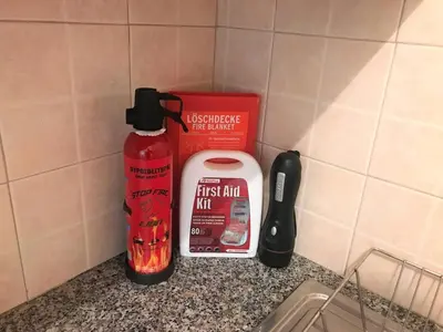 a bottle of fire mix next to a container ofadobe at Andros Apt 2 Bed, Free Wi-fi, Safe, Complex Pool in Paralimni