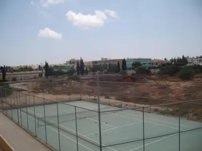 a tennis court on top of a building at Andros Apt 2 Bed, Free Wi-fi, Safe, Complex Pool in Paralimni