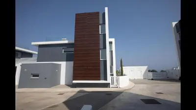 a building with a brick pillar on the side of it at Protaras Olivine Villa Ol10 in Protaras