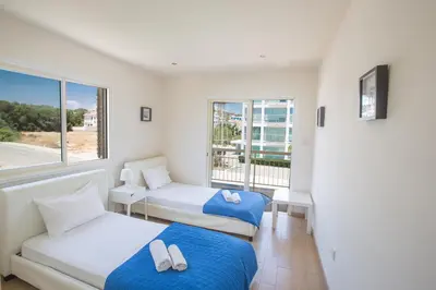 a room with two beds and a window at Protaras Holiday Villa Dv16 in Protaras