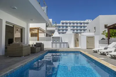 a villa with a swimming pool and a house at Protaras Sunrise Beach Villa 2 in Protaras
