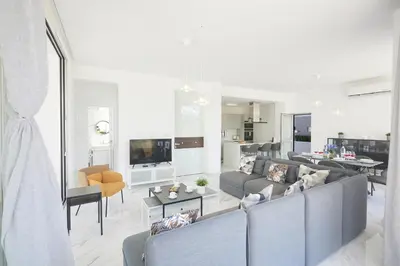 a living room with a couch and a table at Protaras Olivine Villa Ol13 in Protaras