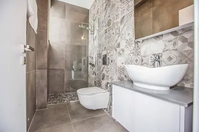 a bathroom with a sink and a toilet and a shower at Villa Olivine Pearl 6 in Protaras