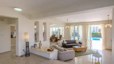 a living room with a couch and a table at Cape Greco Villa Anastel 2 in Ayia Napa