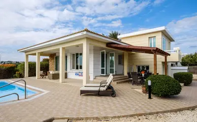 a house with a patio and a swimming pool at Cape Greco Villa Anastel 2 in Ayia Napa