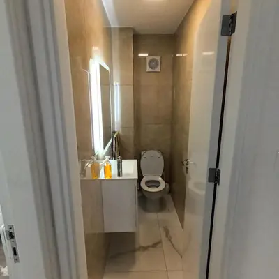 a small bathroom with a toilet and a sink at Villa Aleksandar in Protaras