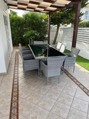 a patio with a table and chairs on a patio at Villa Aleksandar in Protaras
