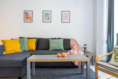 a living room with a couch and a coffee table at Crystal 2-Bedroom Apartment in Larnaca in Larnaka