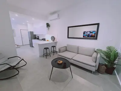 a living room with a couch and a table at STAY Anemone 19 in Protaras