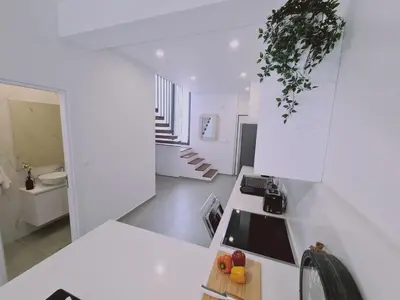 a kitchen with white walls and a white counter top at STAY Anemone 19 in Protaras