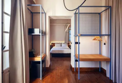 a bedroom with a bed and a bunk bed at Heart Hotel in Limassol