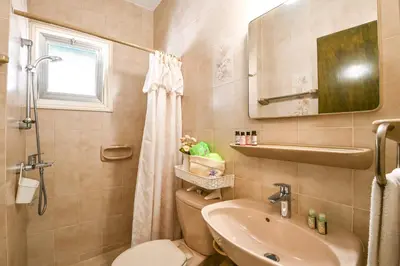 a bathroom with a toilet and a sink at Villa 361-Walk to Protaras Fig Tree Bay & Amenities in Protaras