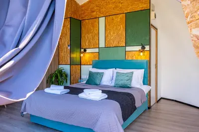 a bedroom with a blue bed with towels on it at Amazing Cyprus Glamping Domes - Glamping Cyprus in Paphos City
