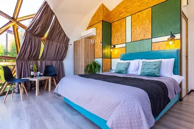 a bedroom with a bed and a table and chairs at Amazing Cyprus Glamping Domes - Glamping Cyprus in Paphos City