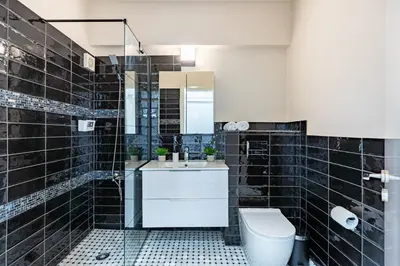 a bathroom with a toilet and a sink at Vox 2-Bedroom Apartment in Larnaca in Larnaka