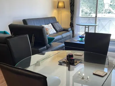 a living room with a glass table and a couch at Belleview Heights in Limassol