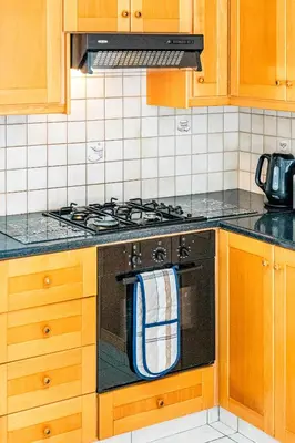 a kitchen with a stove with a towel on the oven at Villa Sunnyside Mandali by Ezoria Villas in Protaras