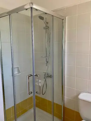 a shower with a glass door in a bathroom at Villa Lorena Protaras in Protaras