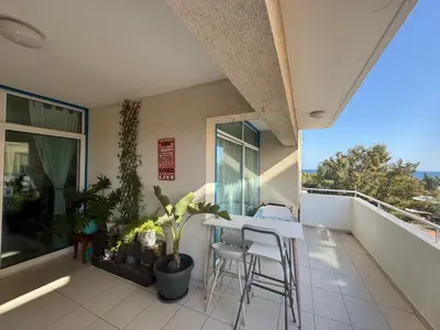 a balcony with a table and chairs on a balcony at Seaview Harmony in Larnaka