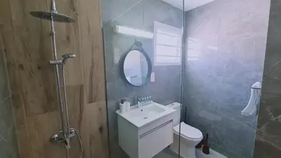 a bathroom with a toilet and a sink and a mirror at Nissi avenue 64 Studio 2 - Luxcyservices in Ayia Napa
