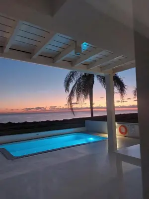 a house with a swimming pool with a view of the ocean at Narcissus 19 in Paralimni