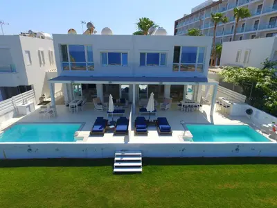 an aerial view of a house with two swimming pools at Narcissus 18 in Paralimni