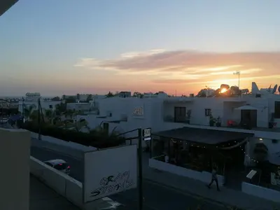 a view of a city at sunset from a building at PoliaNapa Nest in Ayia Napa