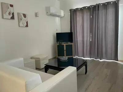 a living room with a couch and a table at PoliaNapa Nest in Ayia Napa