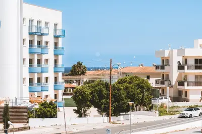 a view of a street in front of buildings at Villa Sunrise Pernera in Paralimni