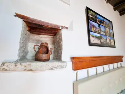 a tea kettle sitting on a fireplace in a room at Poseidon's Pool Paradise in Skarinou