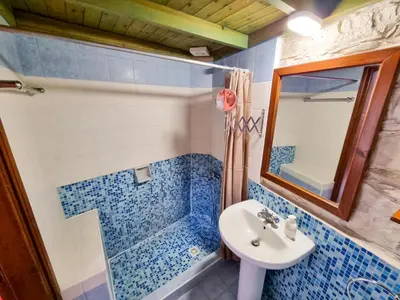 a bathroom with a sink and a shower at Aphrodite's Pool Retreat in Skarinou