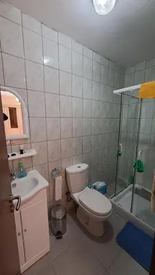 a bathroom with a toilet and a sink and a shower at Mountain View 2BR House with Garden & Free Parking Ioannis Ylation Saranti in Nicosia