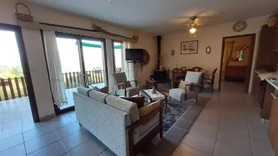 a living room with a couch and chairs and a balcony at Mountain View 2BR House with Garden & Free Parking Ioannis Ylation Saranti in Nicosia
