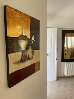 a painting of a vase on a wall at Villa Flory in Protaras